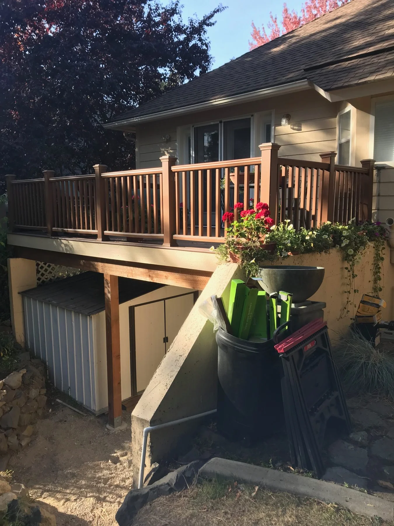 A stunning natural cedar deck in a backyard setting.